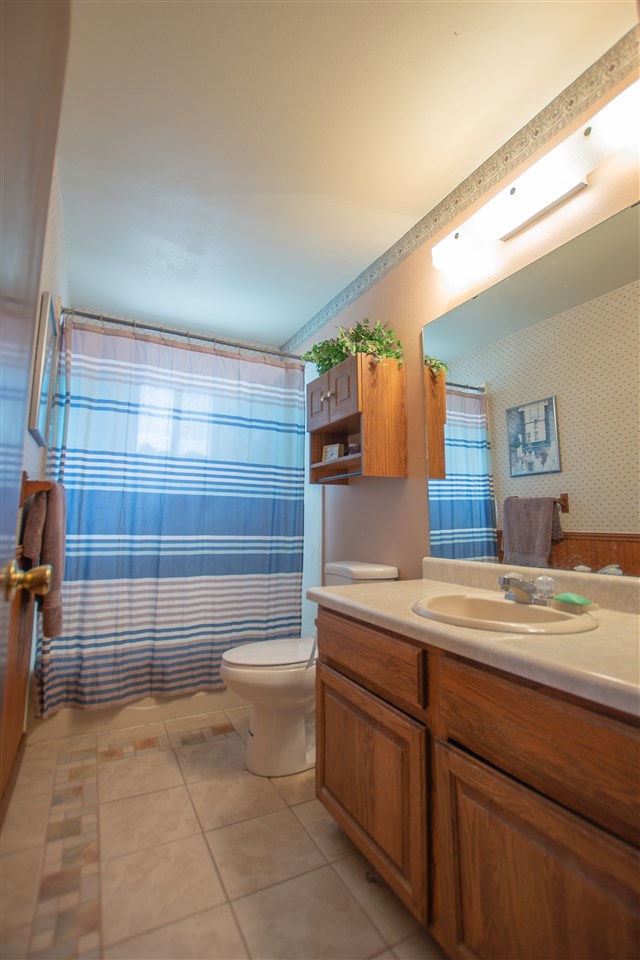 1181 19 Road Fruita, CO 81521 - Photo 11 of 26 a bathroom with a sink a toilet and shower