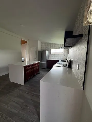a kitchen with sink and cabinets