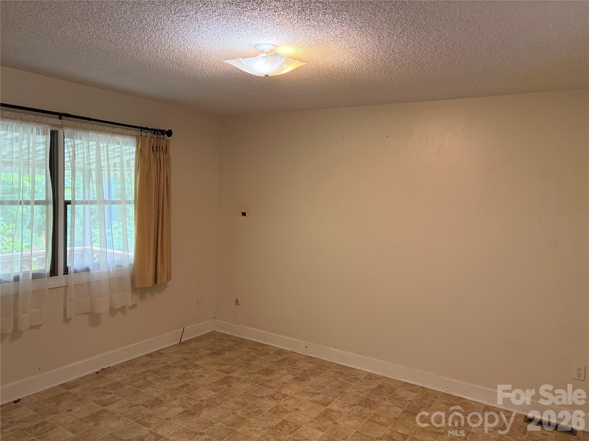 256 A Bruce Road Mars Hill, NC 28754 - Photo 34 of 39 an empty room with a window