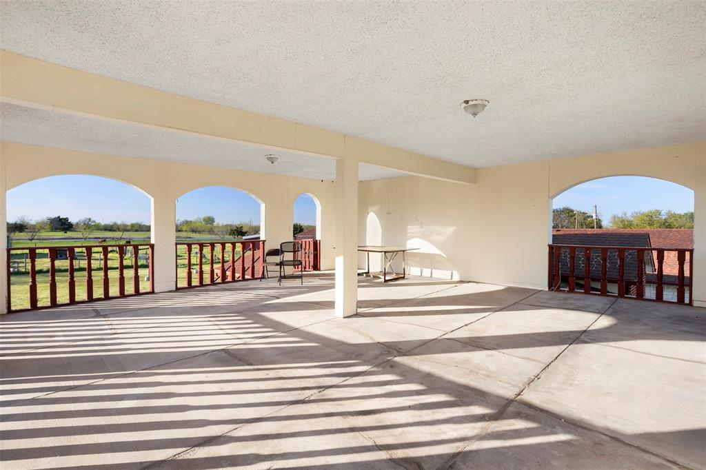 6524 Fair Road Kaufman, TX 75142 - Photo 24 of 30 a view of front door and porch with wooden floor