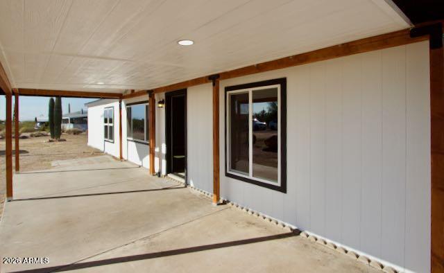 1470 South Bowman Road Apache Junction, AZ 85119 - Photo 15 of 57 a view of a hallway with wooden floor and door