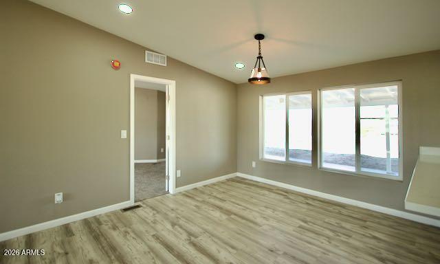1470 South Bowman Road Apache Junction, AZ 85119 - Photo 21 of 57 wooden floor in an empty room with a window