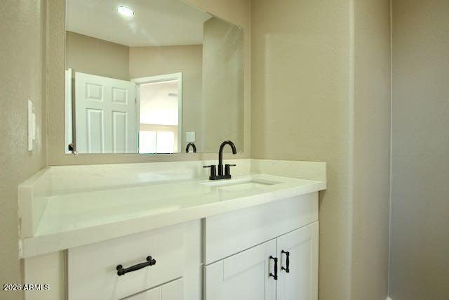 1470 South Bowman Road Apache Junction, AZ 85119 - Photo 39 of 57 a bathroom with a sink and a mirror