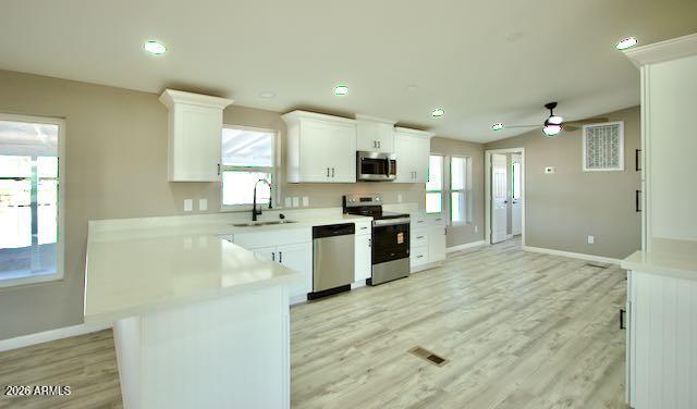 1470 South Bowman Road Apache Junction, AZ 85119 - Photo 4 of 57 a large kitchen with stainless steel appliances granite countertop a stove a sink and a refrigerator