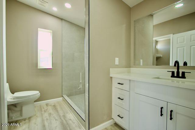 1470 South Bowman Road Apache Junction, AZ 85119 - Photo 41 of 57 a bathroom with a granite countertop sink a toilet and a mirror