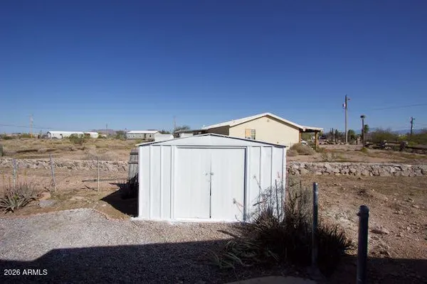 a view of a back yard of the house