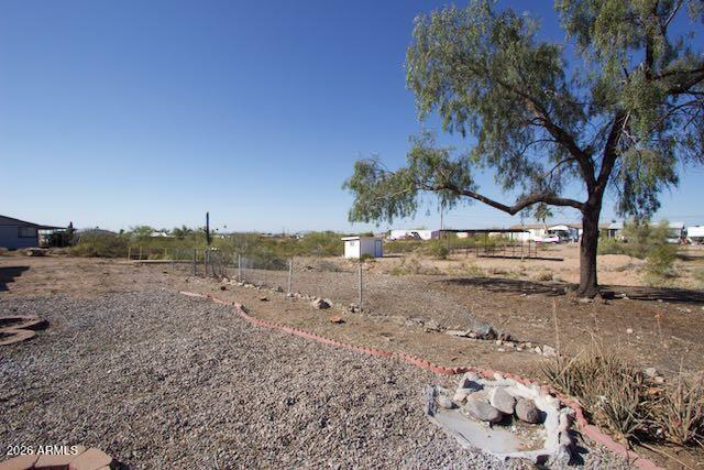 1470 South Bowman Road Apache Junction, AZ 85119 - Photo 45 of 57 a view of a road with a trees in the background
