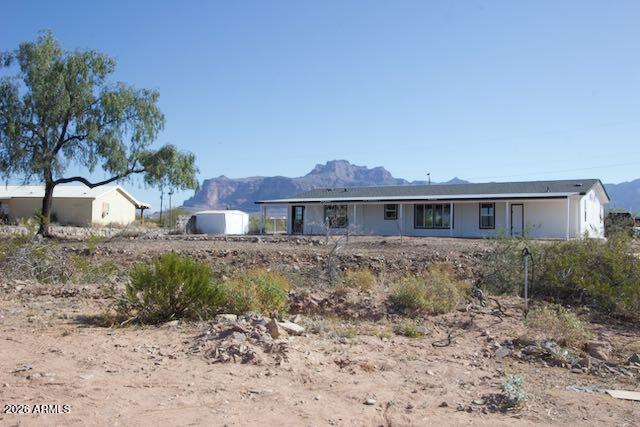 1470 South Bowman Road Apache Junction, AZ 85119 - Photo 56 of 57 a front view of a house with a yard