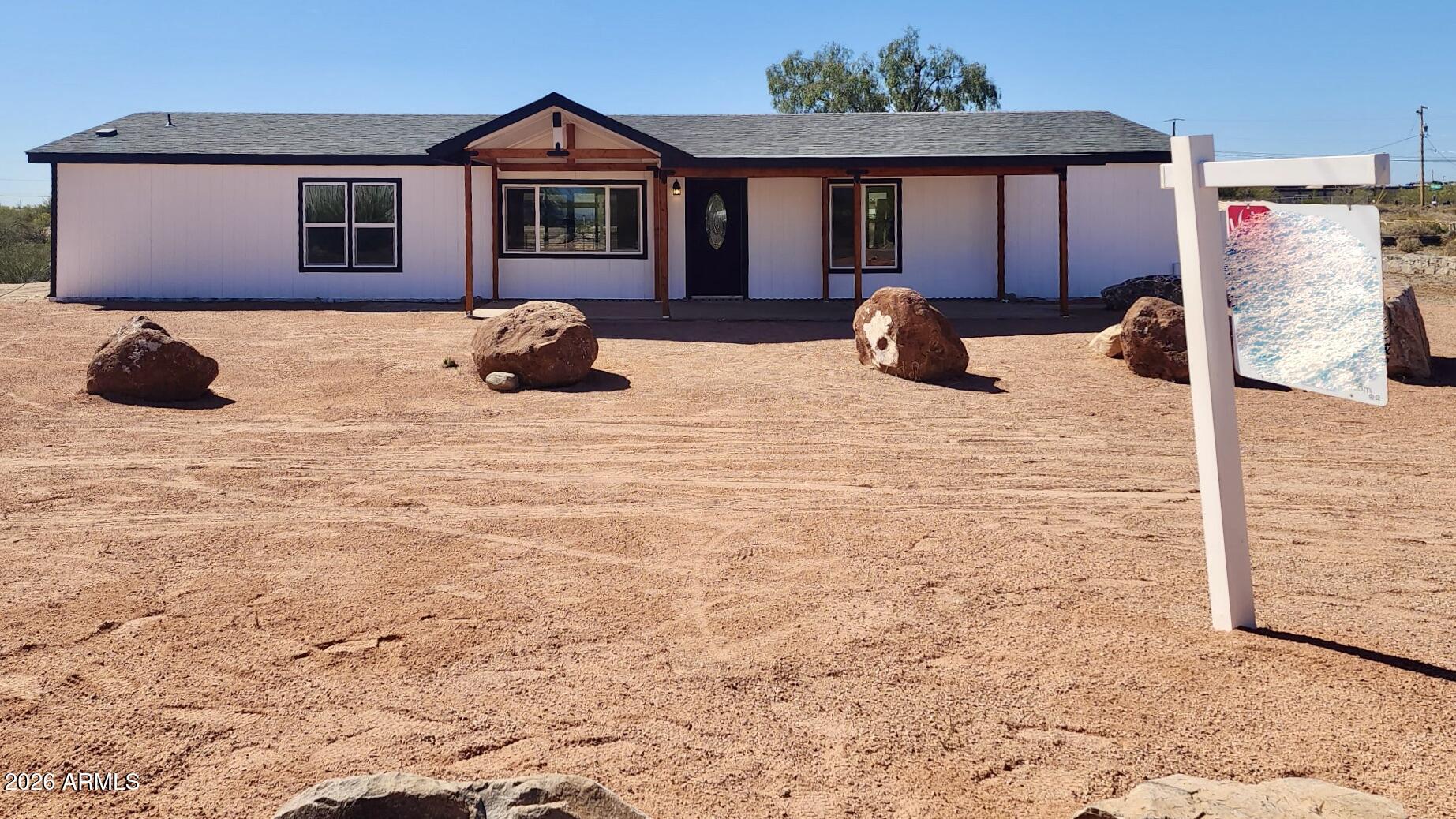 1470 South Bowman Road Apache Junction, AZ 85119 - Photo 9 of 57 a bedroom with a bed and a window
