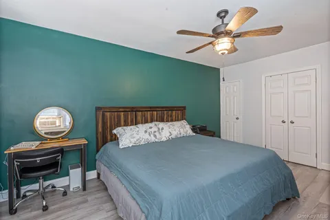 a bedroom with a bed and dresser