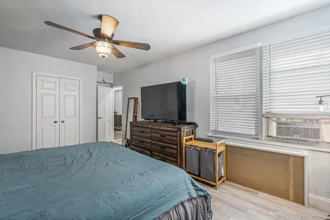 a bedroom with furniture and windows