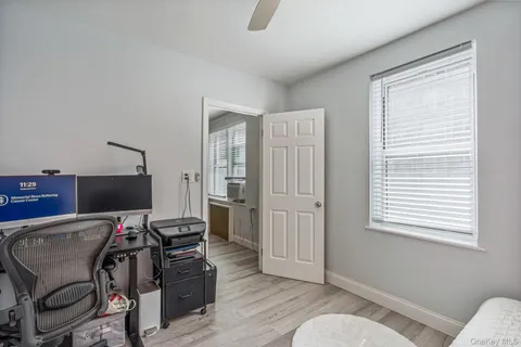 a workspace with furniture and a window