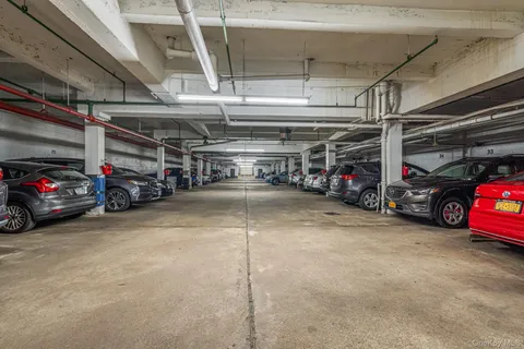 a view of parking garage with cars