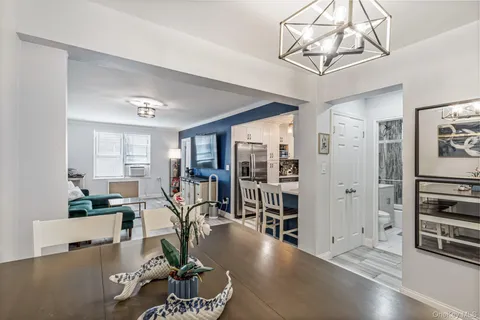 a view of a livingroom with furniture and a window