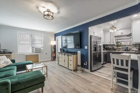 a kitchen with a refrigerator cabinets and a sink