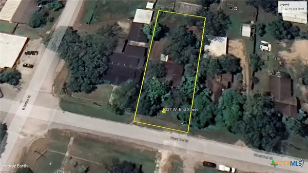 an aerial view of house with yard
