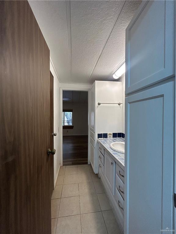 1205 Maple Street Harlingen, TX 78552 - Photo 14 of 23 a kitchen with stainless steel appliances a sink and cabinets
