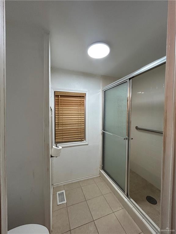 1205 Maple Street Harlingen, TX 78552 - Photo 15 of 23 a bathroom with a shower and toilet