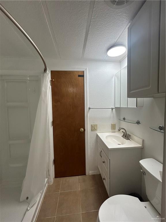 1205 Maple Street Harlingen, TX 78552 - Photo 19 of 23 a bathroom with a sink a toilet and shower