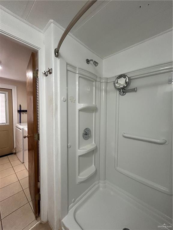 1205 Maple Street Harlingen, TX 78552 - Photo 20 of 23 a bathroom with a shower and a toilet