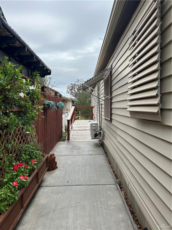 1205 Maple Street Harlingen, TX 78552 - Photo 22 of 23 a view of a pathway both side of house