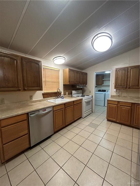 1205 Maple Street Harlingen, TX 78552 - Photo 9 of 23 a kitchen with cabinets a sink and white stainless steel appliances