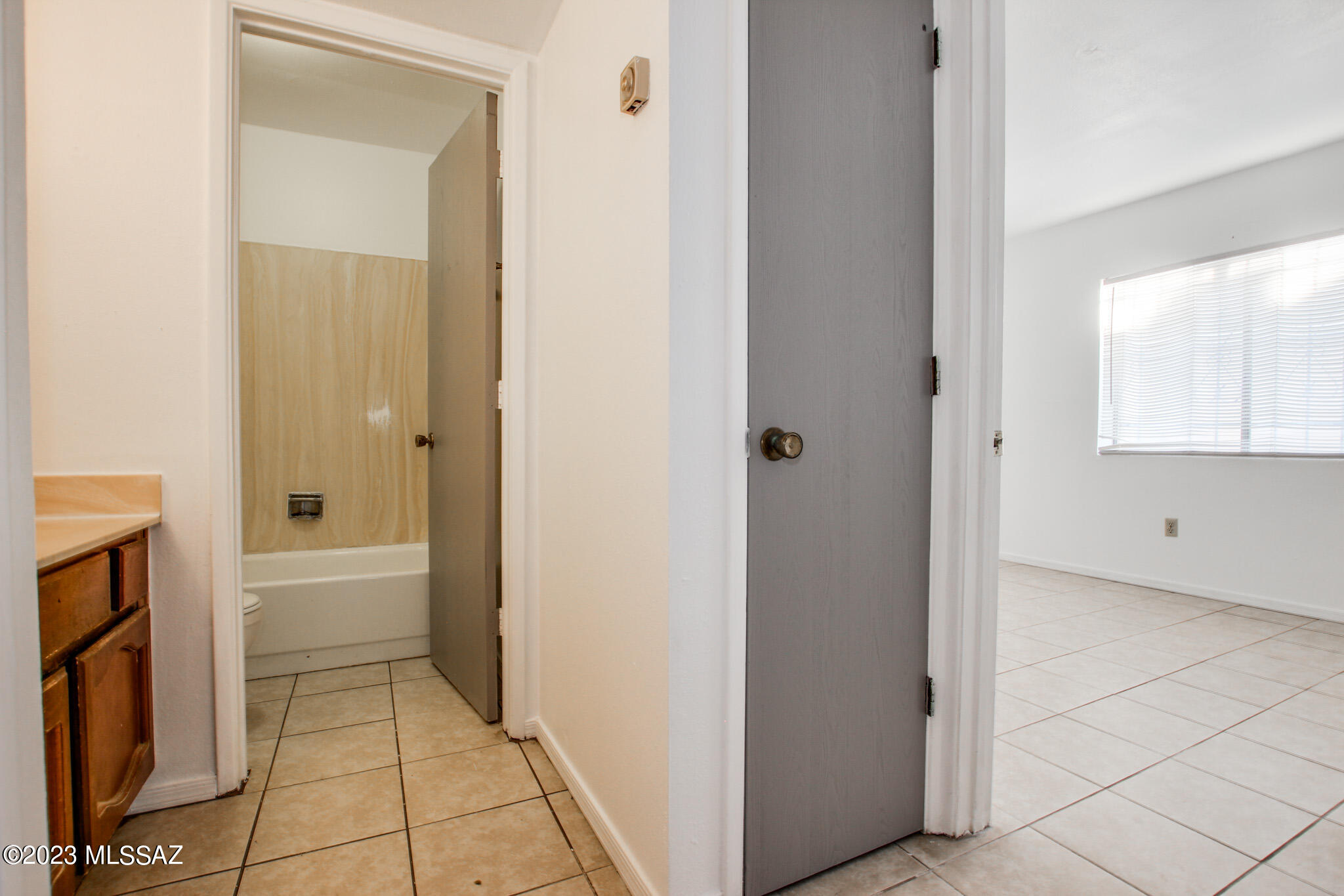 1063 East Halcyon Road Tucson, AZ 85719 - Photo 12 of 35 a bathroom with a bathtub and a shower