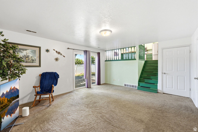 2475 Church Street Layton, UT 84040 - Photo 11 of 27 Carpeted living area featuring white walls and a ceiling light fixture