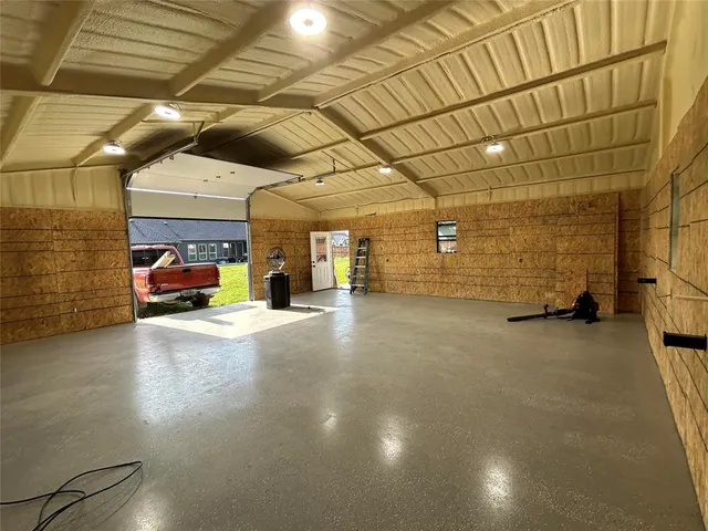 a view of a garage with parked cars