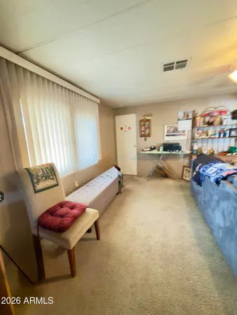 a room with furniture and a chair