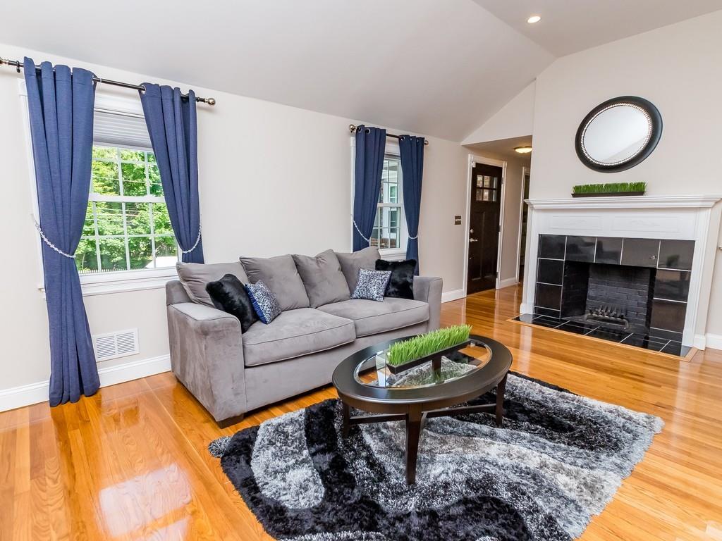 15 Wiswall Road Newton, MA 02459 - Photo 4 of 23 a living room with furniture and a fireplace