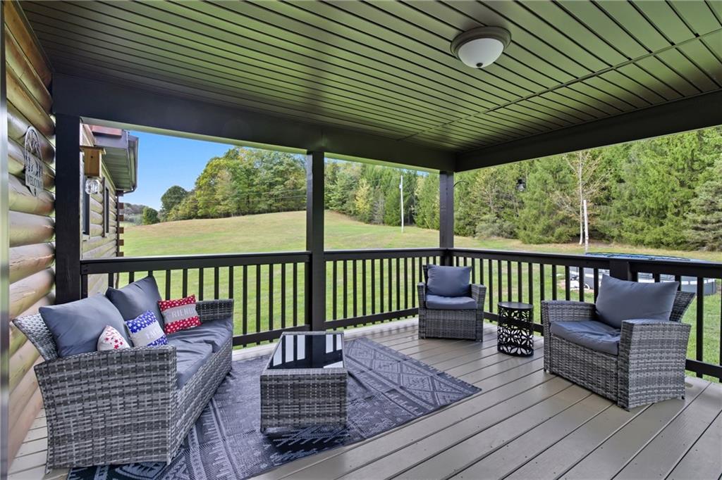 1089 Fire Tower Road Reynoldsville, PA 15851 - Photo 22 of 42 a balcony with furniture and wooden floor
