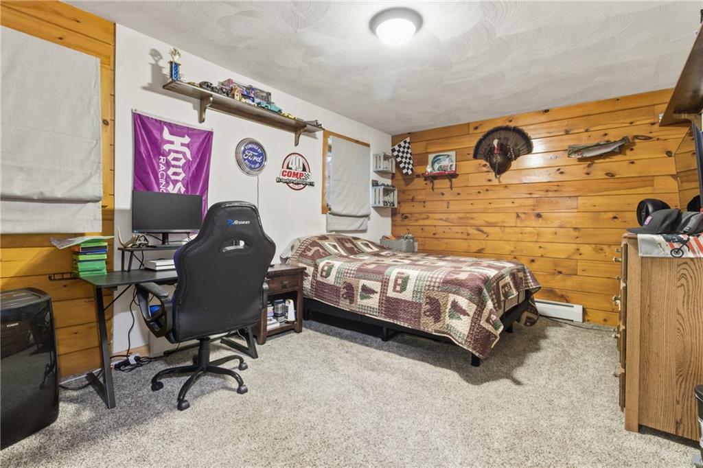 1089 Fire Tower Road Reynoldsville, PA 15851 - Photo 34 of 42 a bedroom with a bed and cabinets