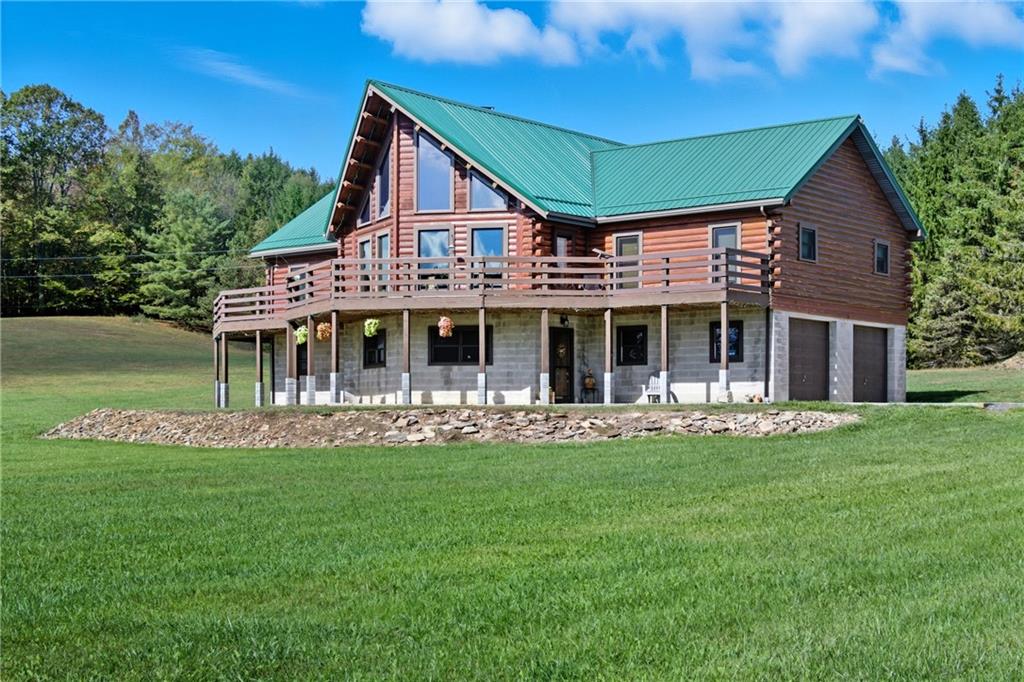 1089 Fire Tower Road Reynoldsville, PA 15851 - Photo 4 of 42 a front view of a house with a garden