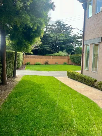a view of a patio and a yard