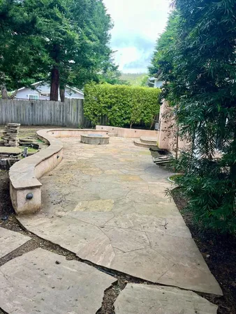 a swimming pool with outdoor seating