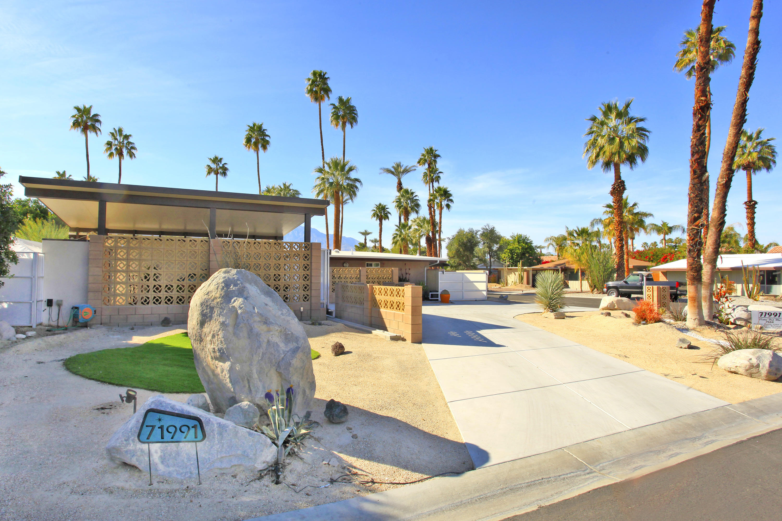 71991 Vista Del Rio Rancho Mirage, CA 92270 - Photo 2 of 34 a view of a swimming pool with a lounge chairs