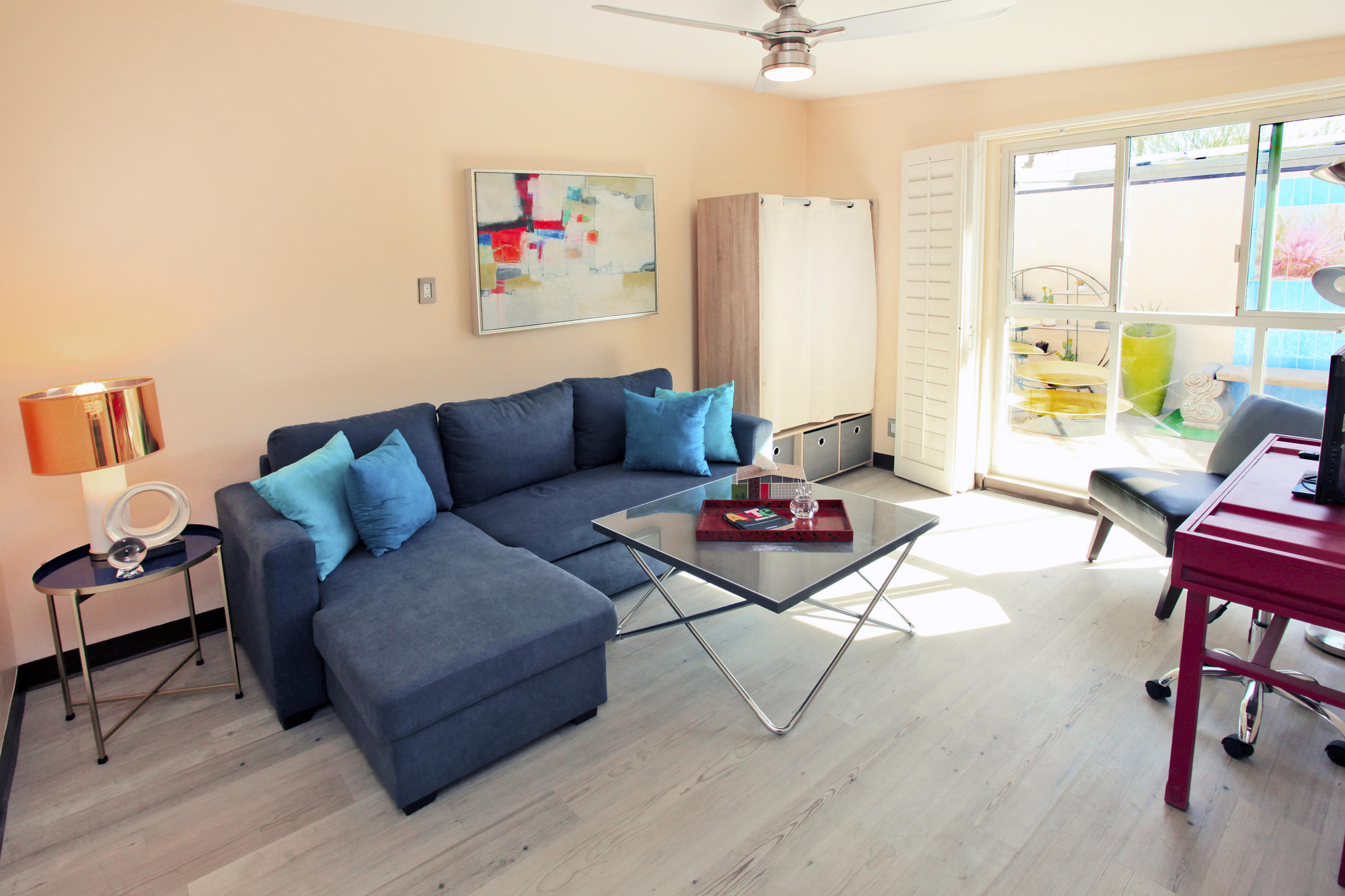 71991 Vista Del Rio Rancho Mirage, CA 92270 - Photo 25 of 34 a living room with furniture and a floor to ceiling window