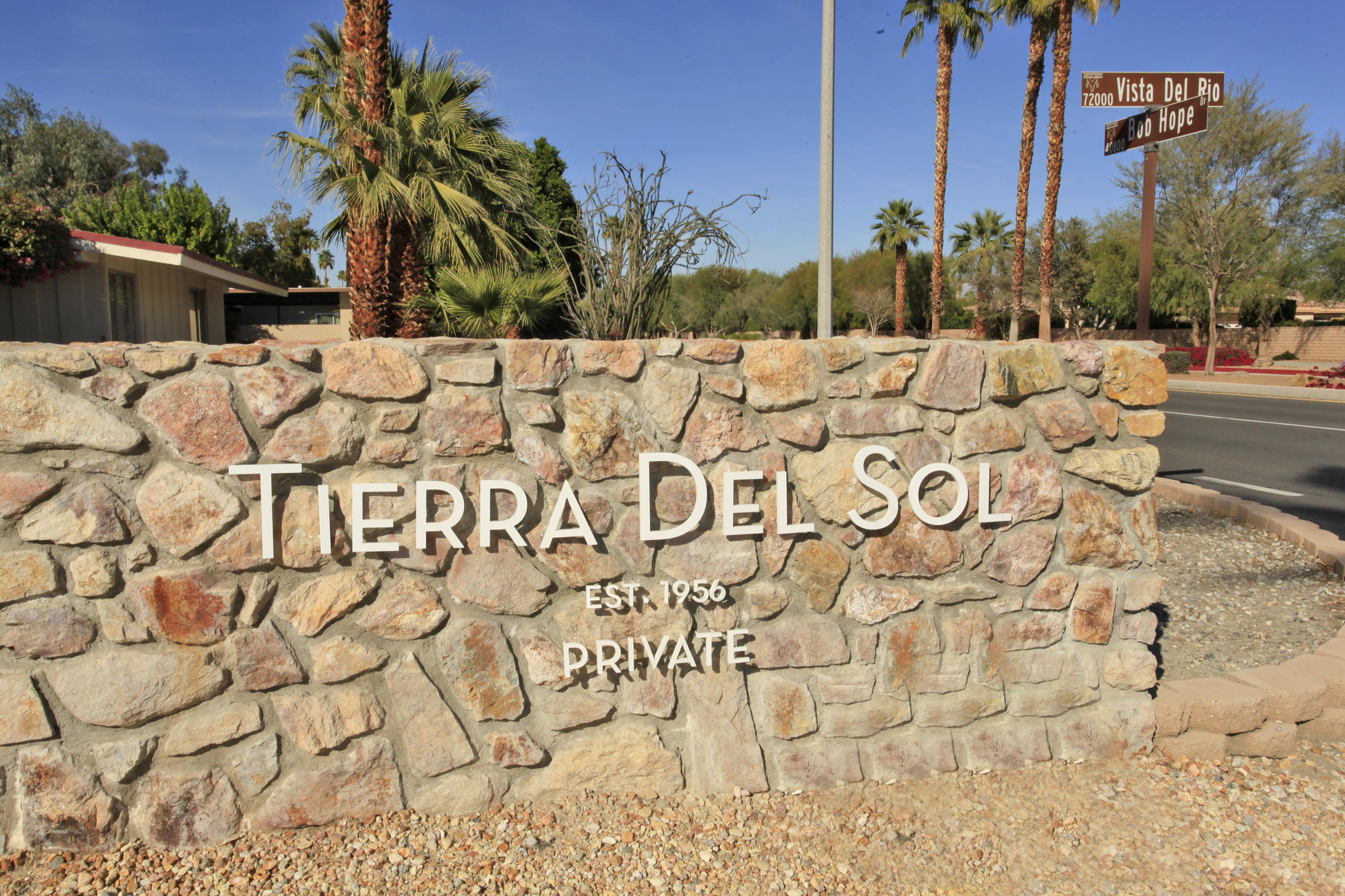 71991 Vista Del Rio Rancho Mirage, CA 92270 - Photo 5 of 34 a view of an white house with a yard