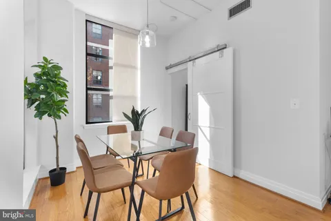 a bedroom with a bed and a lamp