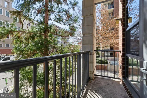 a bedroom with a bed and a lamp