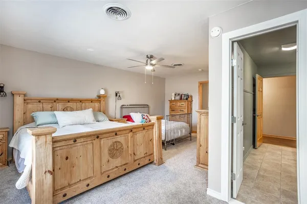 a bedroom with bed and window