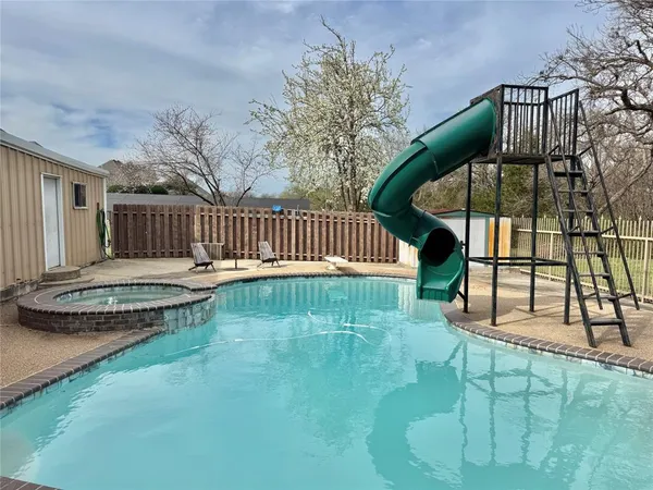 a view of a backyard with a patio