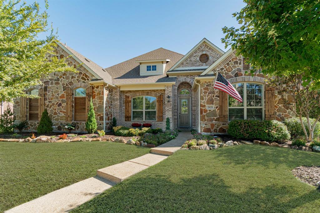 2829 McGregor Drive Frisco, TX 75033 - Photo 1 of 1 a front view of a house with a yard and garage