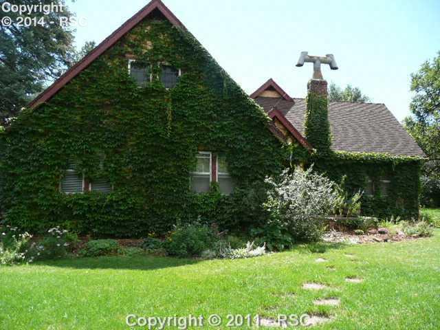 935 West Cheyenne Road Colorado Springs, CO 80906 - Photo 3 of 16 Wonderful gardens, huge trees and mature landscaping on almost an acre of land