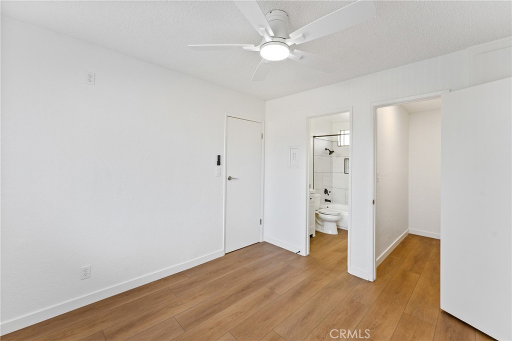 221 10th Street Huntington Beach, CA 92648 - Photo 11 of 20 a view of an empty room with wooden floor