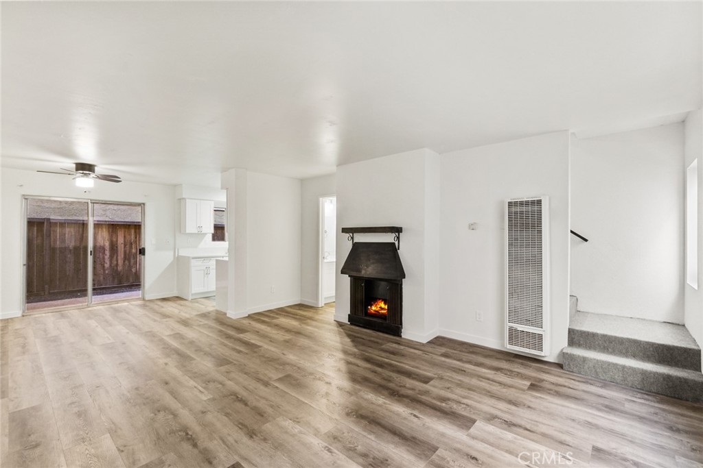 221 10th Street Huntington Beach, CA 92648 - Photo 12 of 20 a view of empty room with a fireplace and window