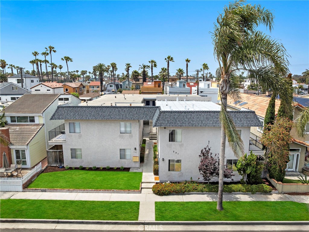 221 10th Street Huntington Beach, CA 92648 - Photo 3 of 20 a front view of a house with garden