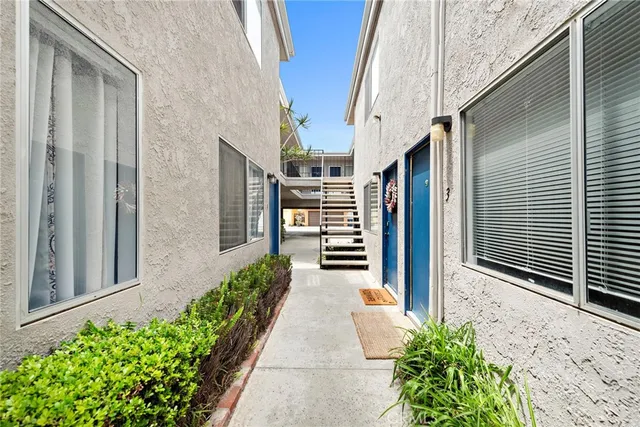 a view of a pathway besides a house