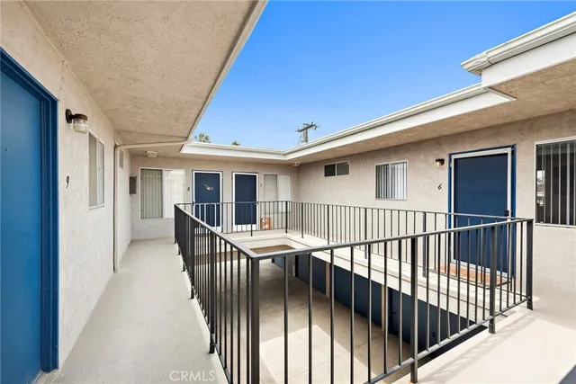 a view of backyard with deck and furniture
